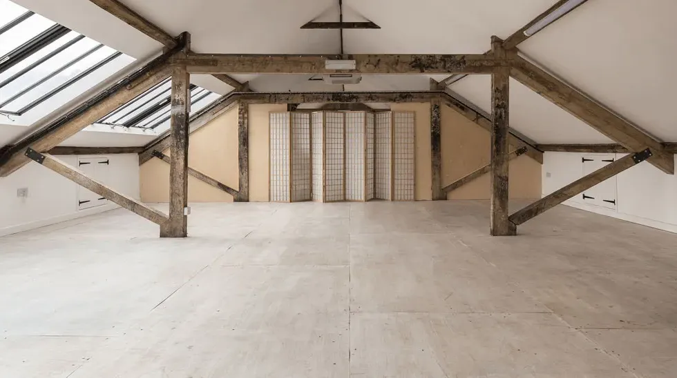Pegasus Art Attic Studio room for corporate hire - large light space with windows, cross beams and screen