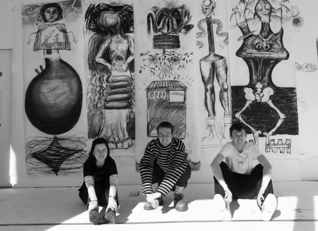Willa Hilditch, Dougal Kirkland and Milo Kester with their large scale drawings. They are artists in residence at John Street Gallery in Stroud. 