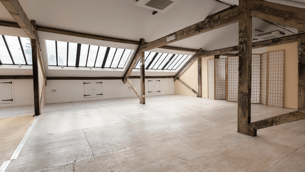 Pegasus Art Attic Studio room for corporate hire - large light space with windows, cross beams and screen