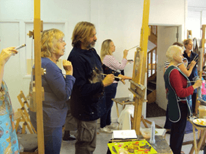 max hale looking at a sturdy wooden easel for oil painting