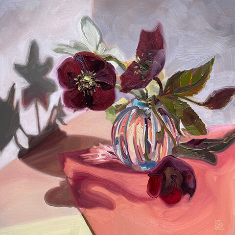 lucy burton red flowers in glass vase with shadow