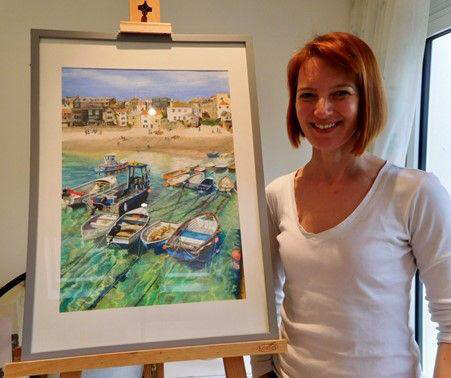 Lucy Burton - stood with painting in frame on easel