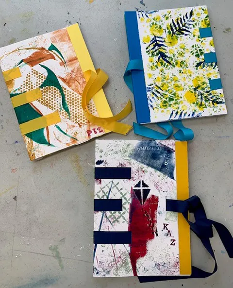 Magalie Briand bookbinding - 3 handmade sketchbooks with primary colours