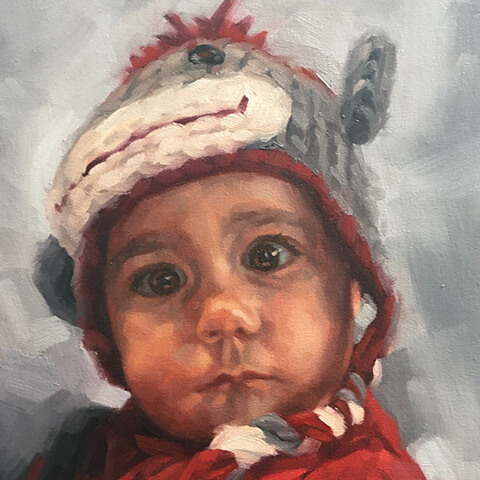 Mark Fennell - portrait of a toddler with monkey hat and red coat