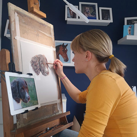 Rachael Kuczaj drawing in her studio